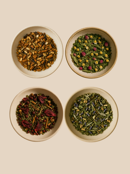 Herbal tea blends in bowls — natural loose leaf teas for energy, hormone balance, and menstrual support